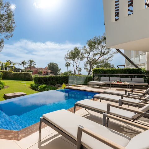Soak in the sunshine from one of the sun loungers before a dip in the pool