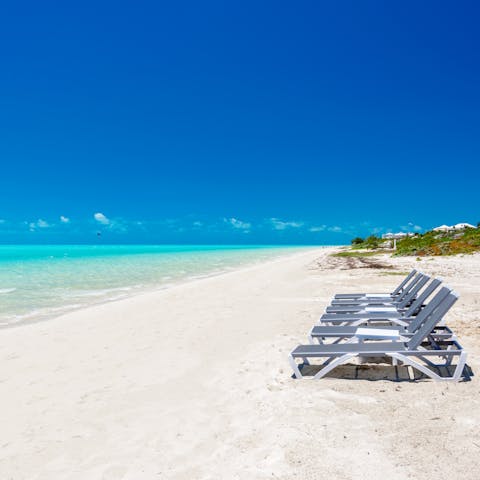 Head down to the gorgeous Long Bay beach and find sun loungers set up for you