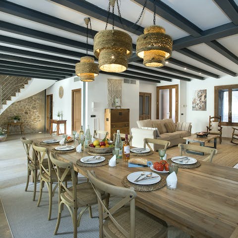 Gather your group for a feast at the wooden dining table