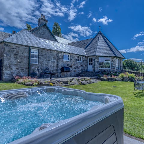 Unwind in the outdoor hot tub as the day draws to a close