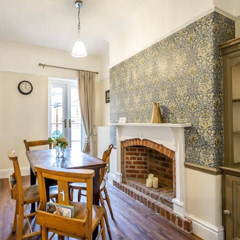 Eat in the charming dining room with a vintage table and chairs