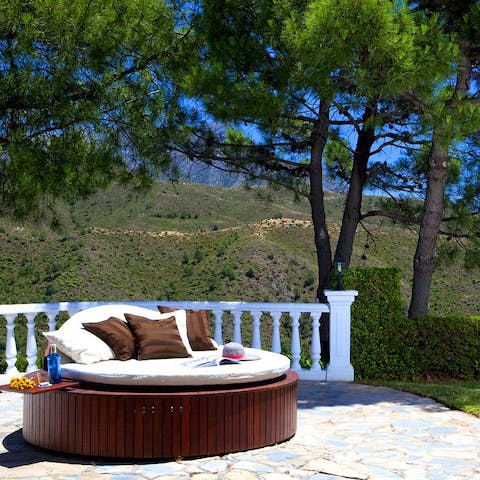 Sunbathe amidst the Mediterranean fauna and flora of the garden