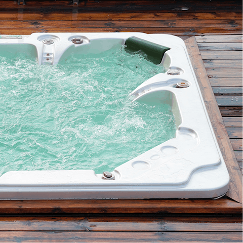 Let your stress slip away in the private hot tub