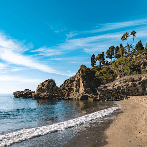 Visit the stunning beaches of Nerja, boasting golden sand, blue seas and rocky cliffs
