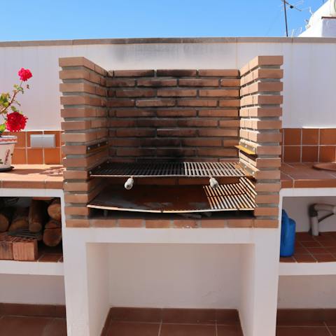 Grill up some Spanish meats and veggies from the market on your rooftop barbecue