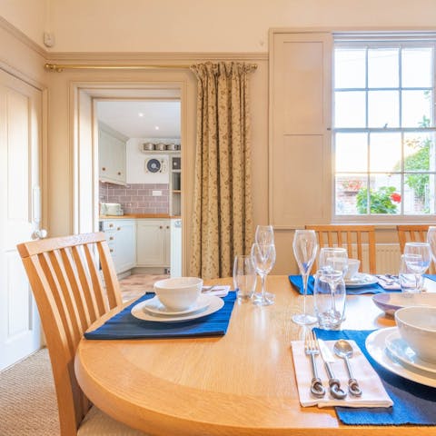 Gather together for a delicious meal in the light-filled dining room