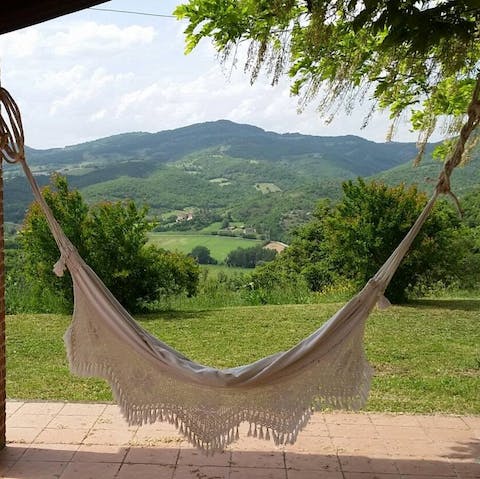 Relax in a hammock with a book and enjoy the shade