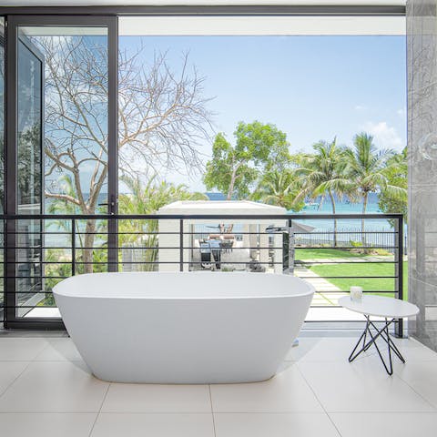 Unwind after a fun-filled day at the beach in the luxurious bathtub