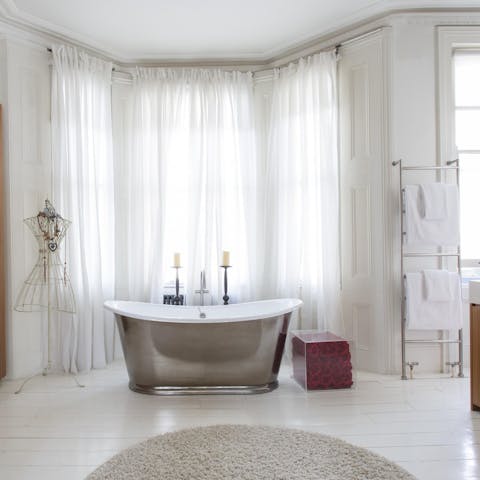 Soak travel weary legs in the freestanding bath, there's room for two