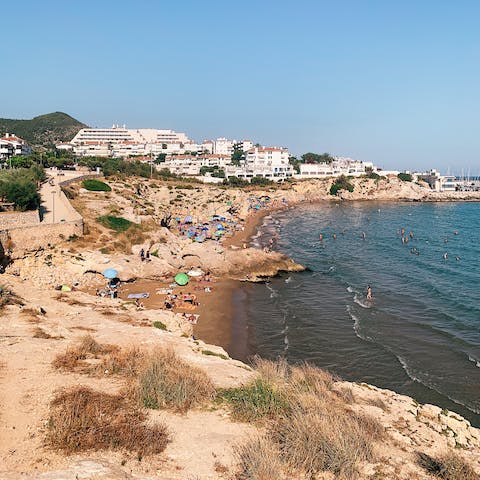 Spend sunny days on Plaja de Sitges – a fifteen-minute drive away