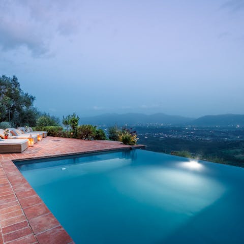 Enjoy a swim in the infinity pool spilling into the Tuscan hills