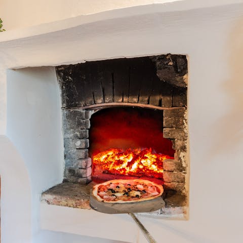 Fire up the pizza oven and nibble on a homemade pie