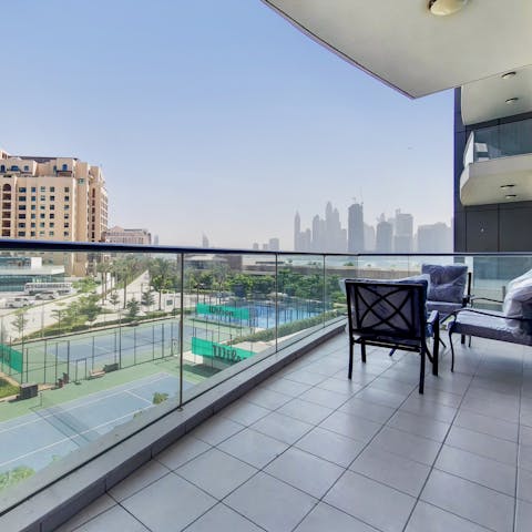 Admire the views over Dubai from your private balcony