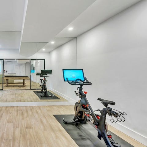Work up a sweat on the Peloton bike in the fitness studio
