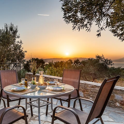 Dig into an alfresco feast prepared on the barbecue as the sun goes down