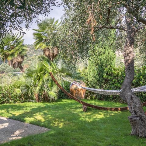 Lose yourself to a good book under the shade of the trees in your private garden