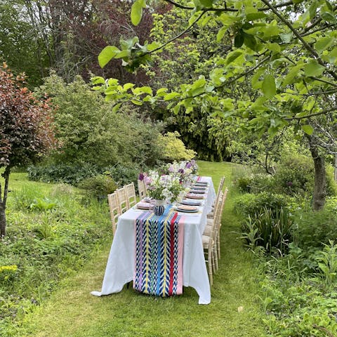 Enjoy an alfresco feast in the lush, green garden