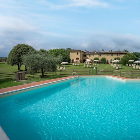 Swim in the communal pool – the perfect respite from the Tuscan heat