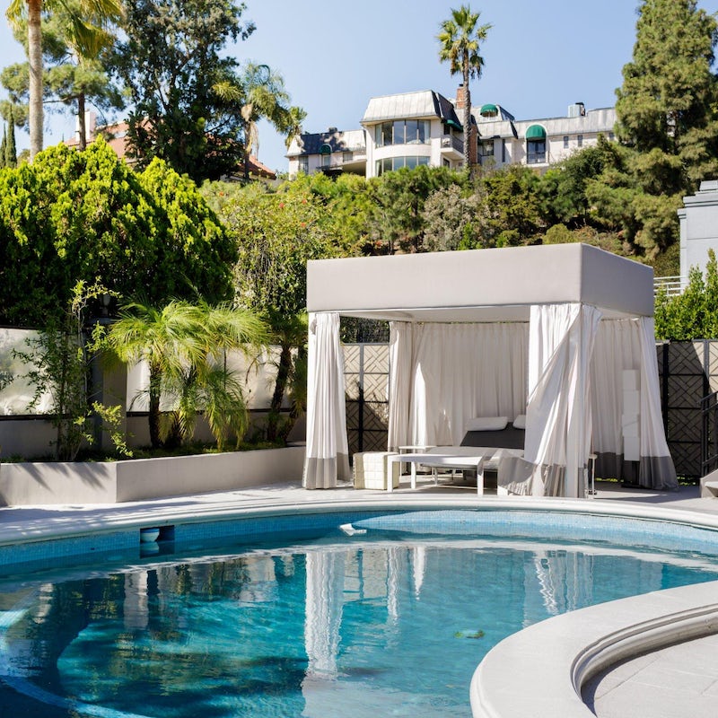 Lounge in the cabana bed by the swimming pool
