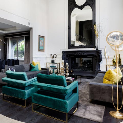 Entertain guests in the grand lounge around the feature fireplace