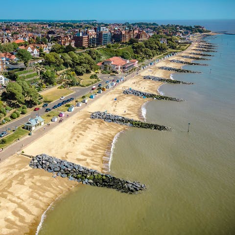 Sink your toes in the sand at Felixstowe Beach, a twenty-minute drive away