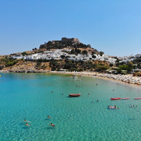 Visit the beautiful town of Lindos, a thirty-minute drive away