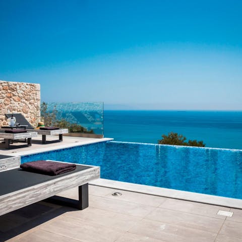 Lounge to your heart's content by the private infinity pool