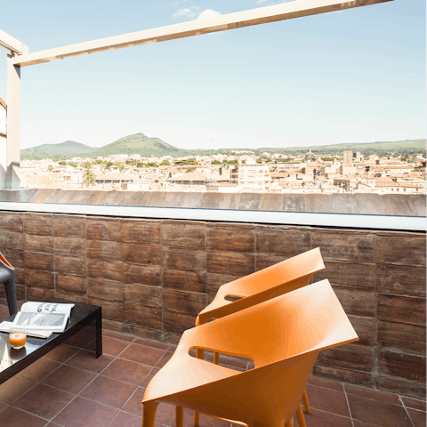 Take brunch on the rooftop terrace overlooking Piazza San Faustino