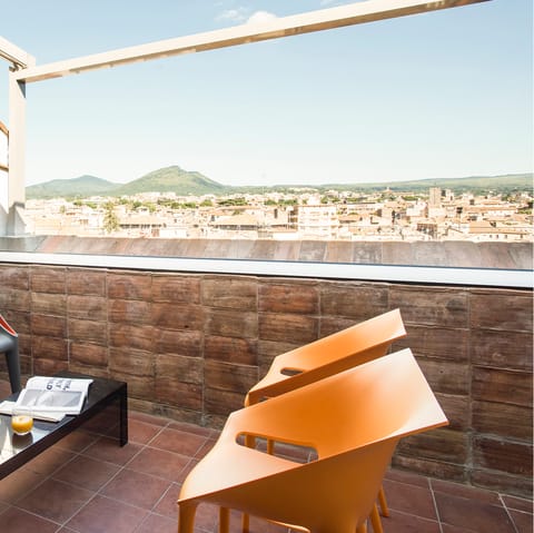 Take brunch on the rooftop terrace overlooking Piazza San Faustino