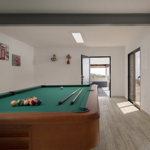 Get a little competitive with a fellow guest in the billiards room