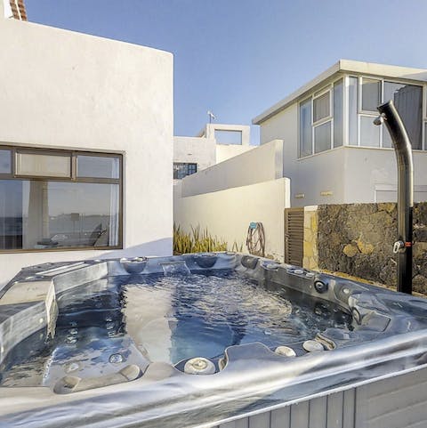 Let the Jacuzzi jets of the private hot tub relax your muscles in the fresh air