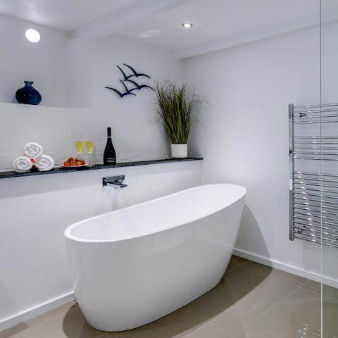 Treat yourself to a long soak in the freestanding bathtub 