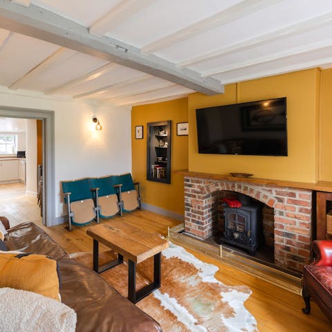 Gather in the cosy living room with the fireplace roaring and a movie on the big screen for the perfect night in