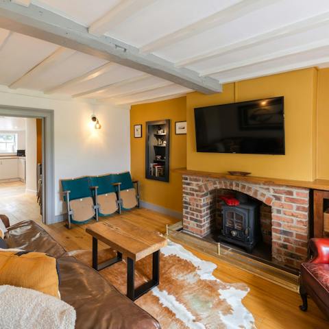 Gather in the cosy living room with the fireplace roaring and a movie on the big screen for the perfect night in
