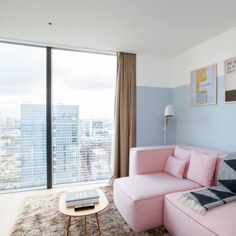 Take in stunning city views from the living room's floor-to-ceiling windows