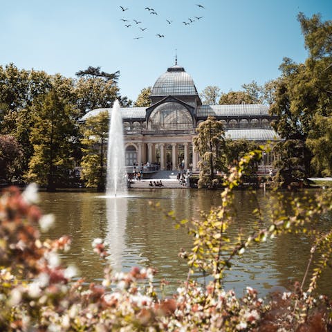 Wander about the monuments and gardens of Parque de El Retiro, fifteen minutes on foot from your front door