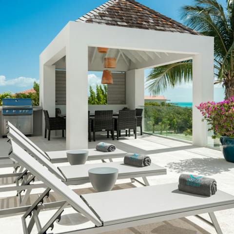 Soak up the island's blissful sunshine from the patio loungers