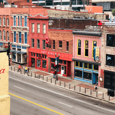 Head to central Nashville, a four-minute drive, and explore the music scene