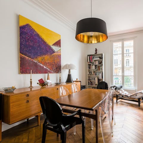 Enjoy a meal together at the large wooden dining table