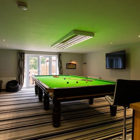 Rack up the balls and play some snooker on the full-size table