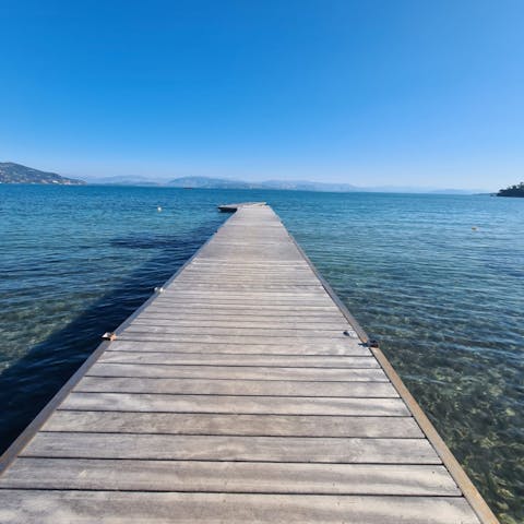 Charter a boat and explore the secret bays of Corfu before mooring up at the private jetty