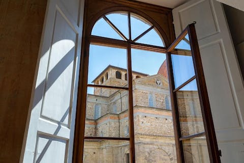 Throw open the master bedroom's tall window and admire the view of Basilica di San Lorenzo