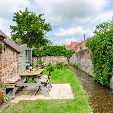 Listen to the stream gently ripple in the quaint back garden