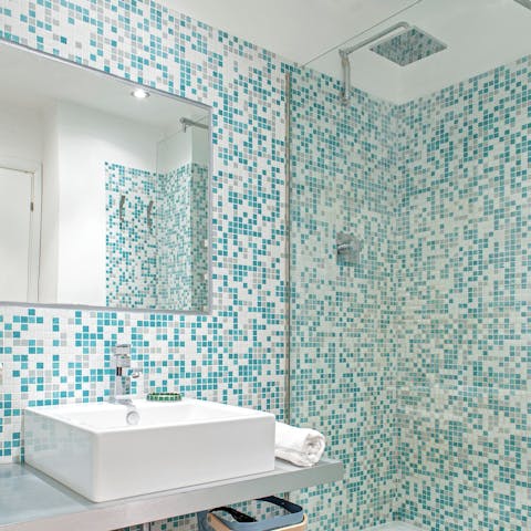Start mornings with a relaxing soak under the bathroom's rainfall shower