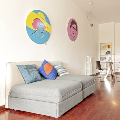 Kick back in the stylish living area after a day of exploring, a glass of Italian wine in hand