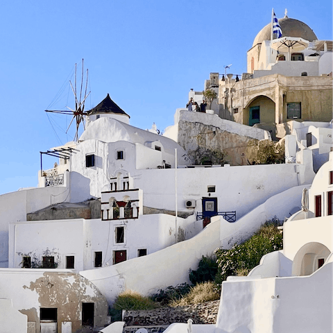 Discover the majestic windmills in Mykonos town – a ten–minute drive away