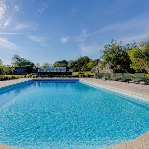 Take a dip in the large heated swimming pool