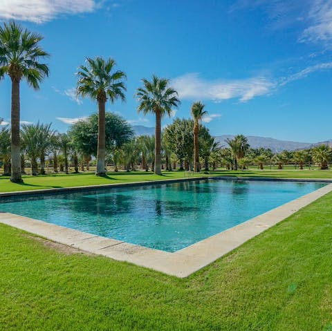 Start the day off with a refreshing dip in the swimming pool and a view of the mountains beyond