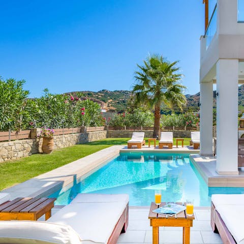 Bask on a plush sun lounger in the Greek sun – and cool down in the private pool