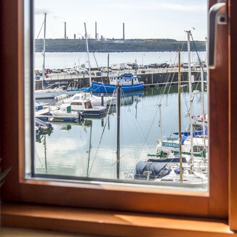 Watch the boats coming in and out of the marina from the home's picture windows